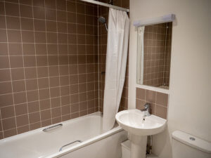 A bathroom inside apartments at Edelweiss Hotel, Colwyn Bay