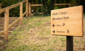 Sign for Woodland Walk at Plas yr Ywen Extra Care